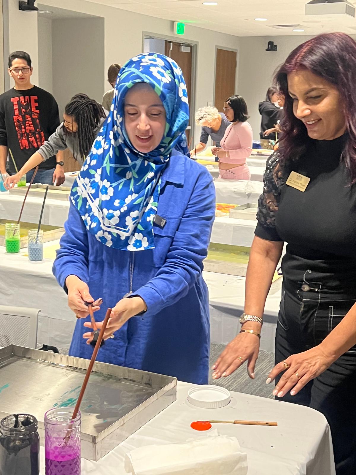Dr. Samira Khan at an art workshop with students