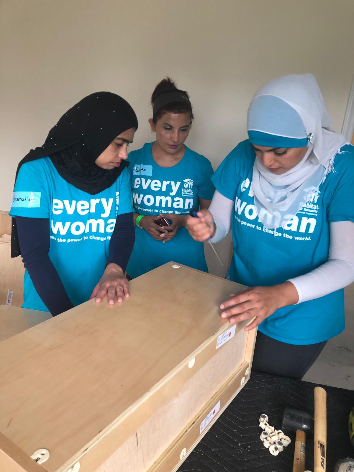 Dr. Samira Khan volunteering with Habitat for Humanity